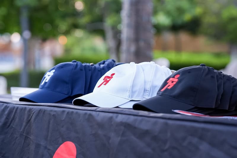 RACE caps on the merch table