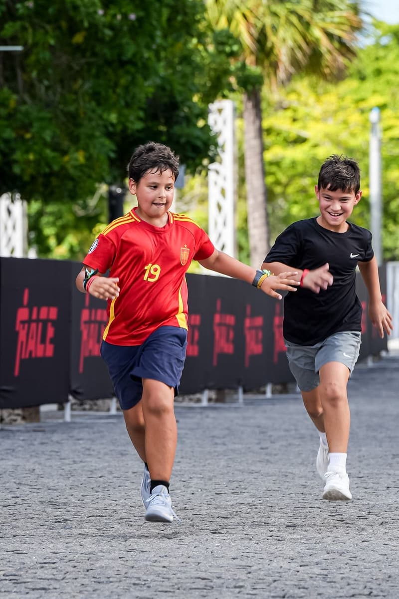 Two kids racing each other to the line