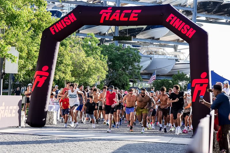 Runners going out under the RACE arch at Vol. 1